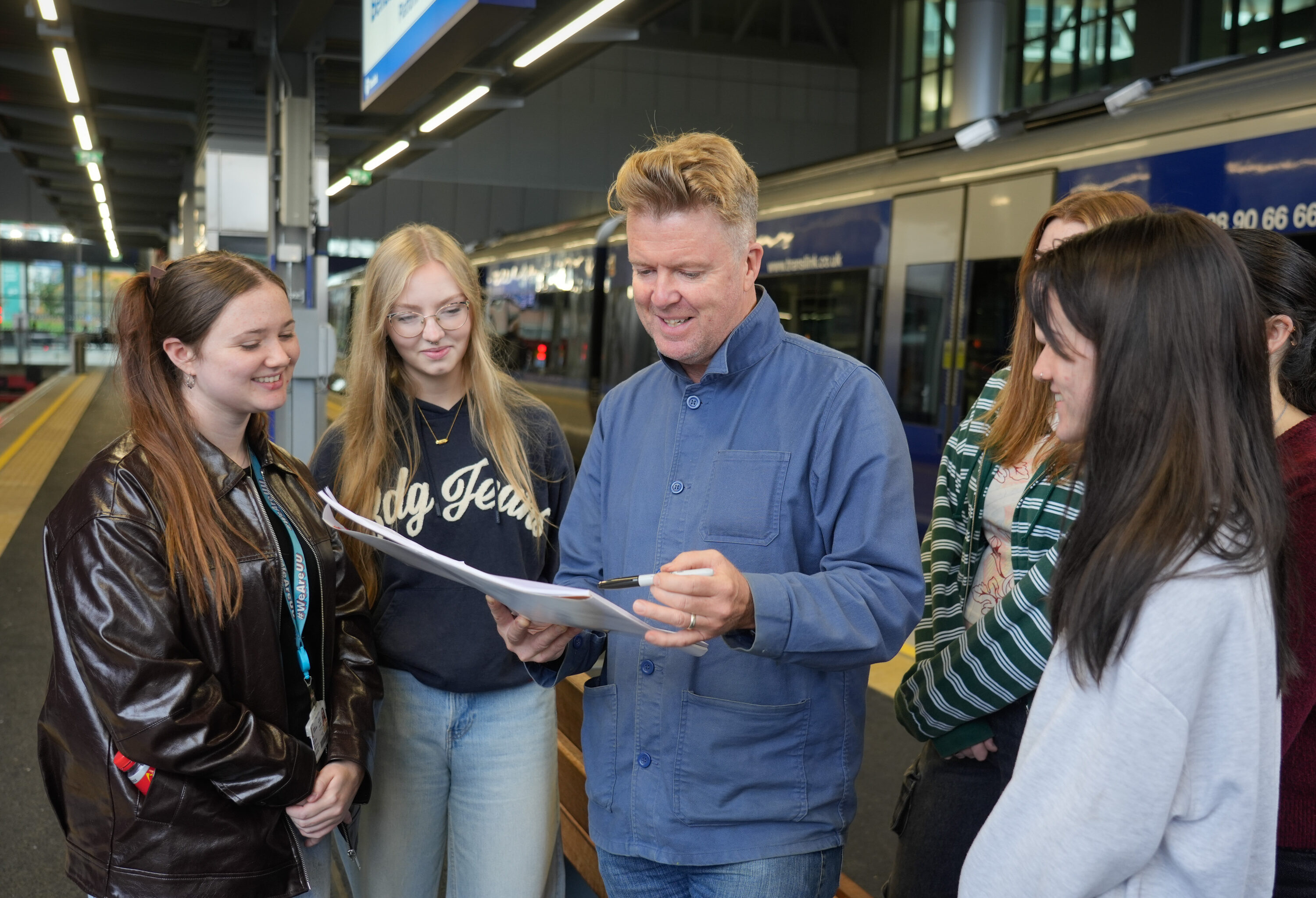 Ed Reynolds Translink artist in residence with a group of students from Belfast School of Art